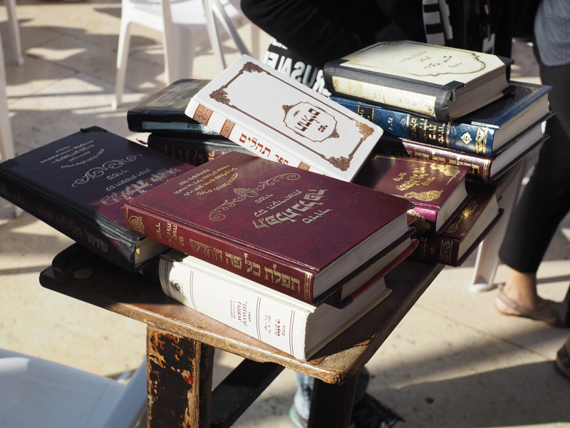 Holy books at Western Wall Jerusalem Tbex press trip